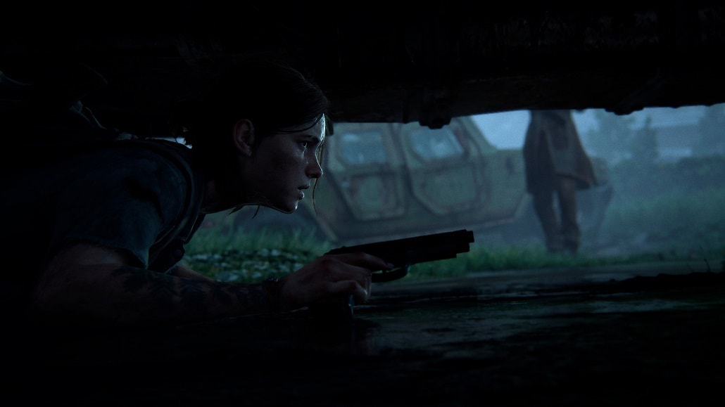 Screen z gry The Last of Us: Part II, Ellie pod samochodem